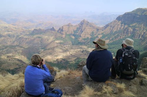 Three travellers looking out over the Simien Mountains, Ethiopia